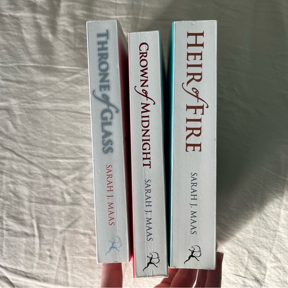 White Paperback Covers of Throne of Glass, Crown of Midnight, and Heir of Fire - Picture 2 of 3
